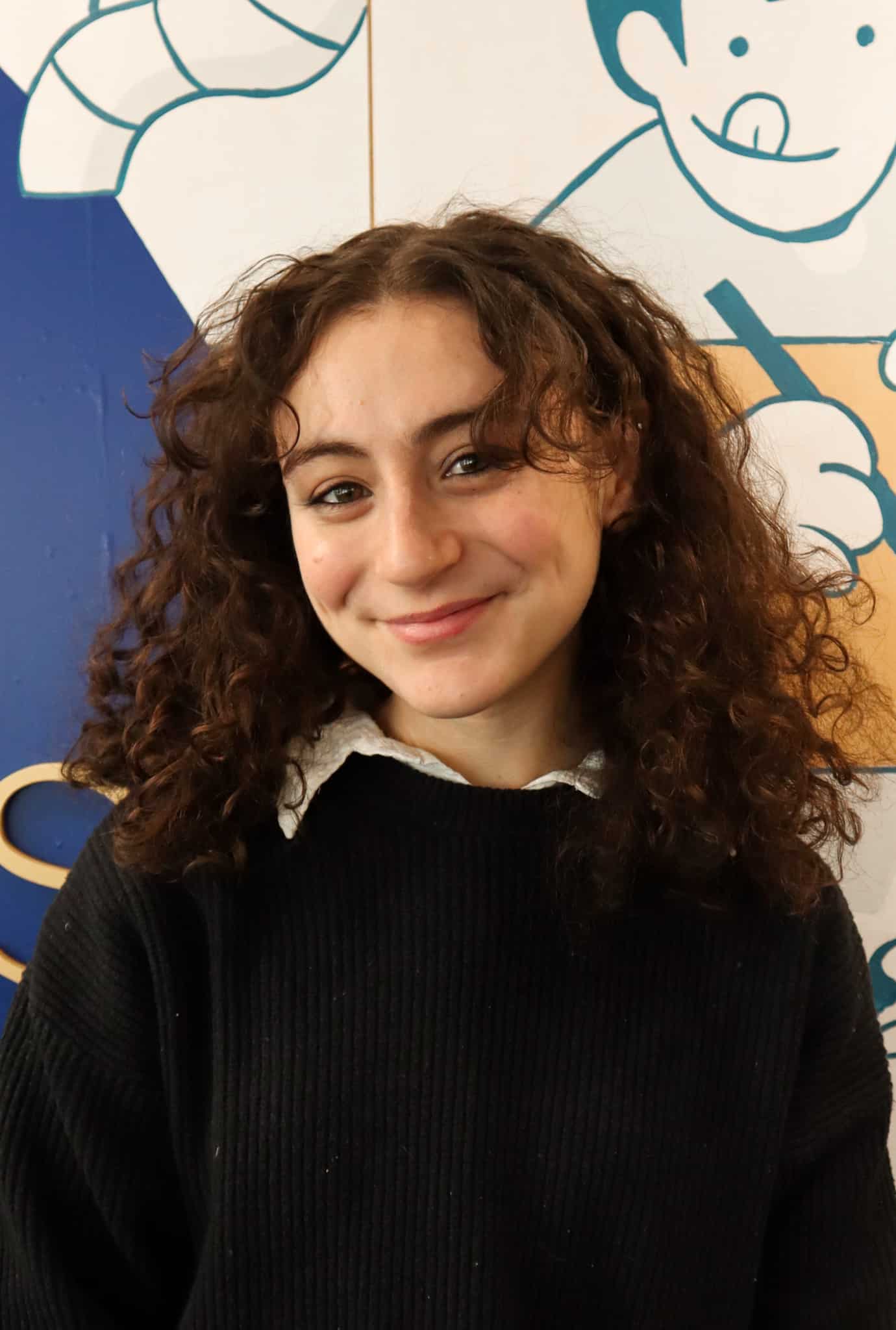 White line icon of a person in a graduation cap, representing Jack Fitzgerald, Social Work Intern.
